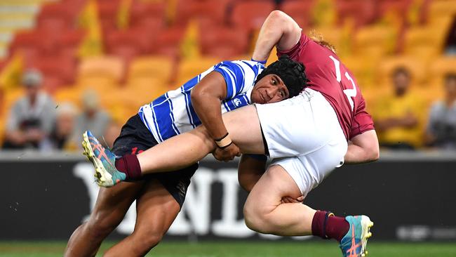 Eyzaiah Ulia of Nudgee College (left) stops Wian Joubert of Brisbane State High in his tracks. Picture: AAP Image