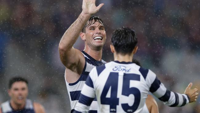 BRISBANE, AUSTRALIA - APRIL 20: Tom Hawkins and Brad Close of the Cats celebrate a goal during the 2024 AFL Round 06 match between the Brisbane Lions and the Geelong Cats at The Gabba on April 20, 2024 in BRISBANE, Australia. (Photo by Russell Freeman/AFL Photos via Getty Images)