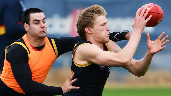 Fischer McAsey battles against Darcy Fogarty at Crows training. Picture: Mark Brake/Getty