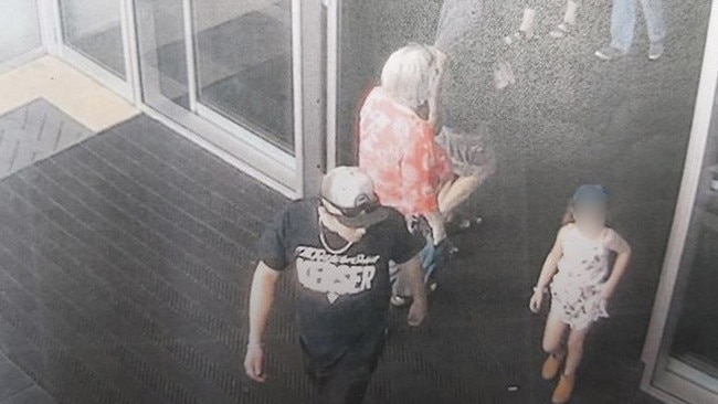 A CCTV image of Sterling Free leaving a north Brisbane shopping centre with a seven-year-old girl he sexually assaulted.