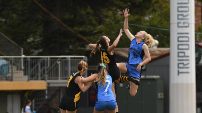 Glenelg's Caitlin Gould (#15) battles Sturt's Zoe Prowse in the ruck earlier this season. Picture: Peter Swan