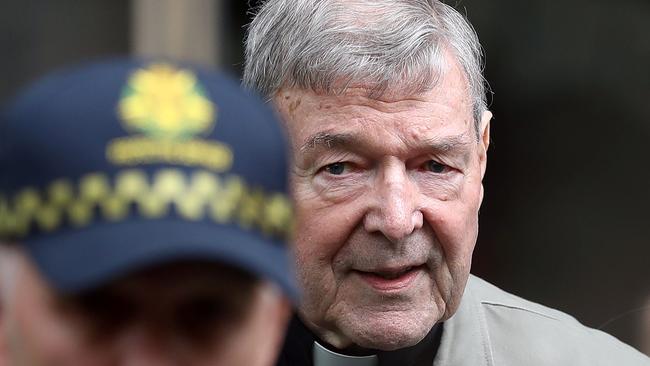 Cardinal George Pell leaves the court after being acquitted of child sexual abuse charges. Picture: Con Chronis/AFP