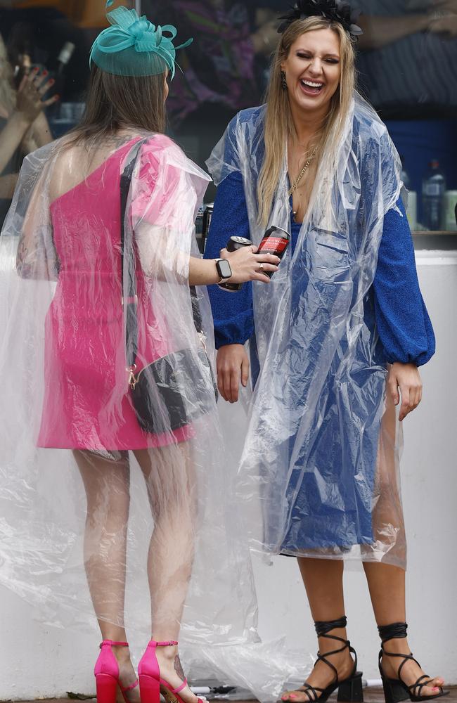 All that time spent getting ready to cover your outfit with a plastic poncho. Picture: Darrian Traynor/Getty Images