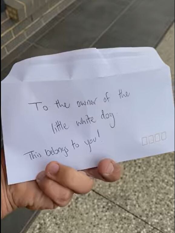 Ashley Mckay returns the dog's poop to the dog's owner. Picture: Facebook