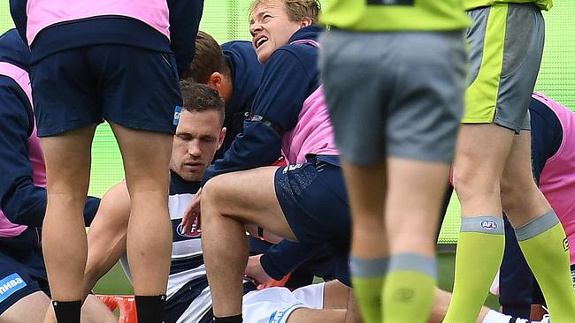 Joel Selwood is helped by trainers on Sunday. Picture: AAP Images