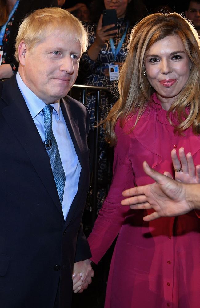 Boris Johnson leaves with his partner Carrie Symonds. Picture: AFP