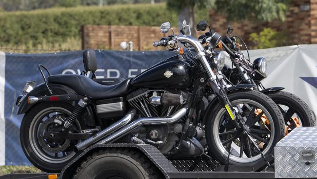 Bikes being carried into the gathering on trailers. Picture: Martin Ollman