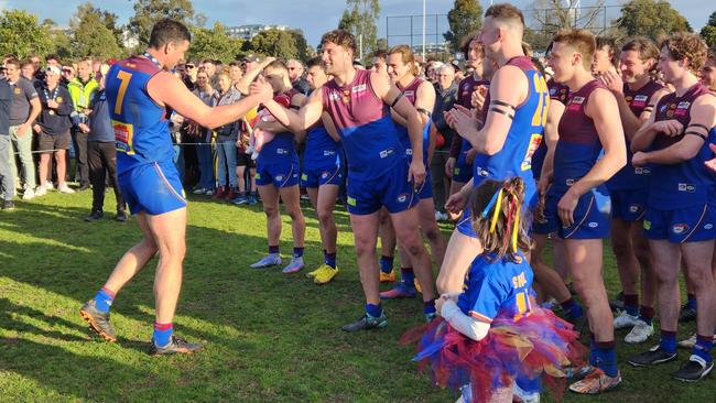 Best on ground medallist Tim Martin is congratulated by his teammates. Picture: Ben Higgins