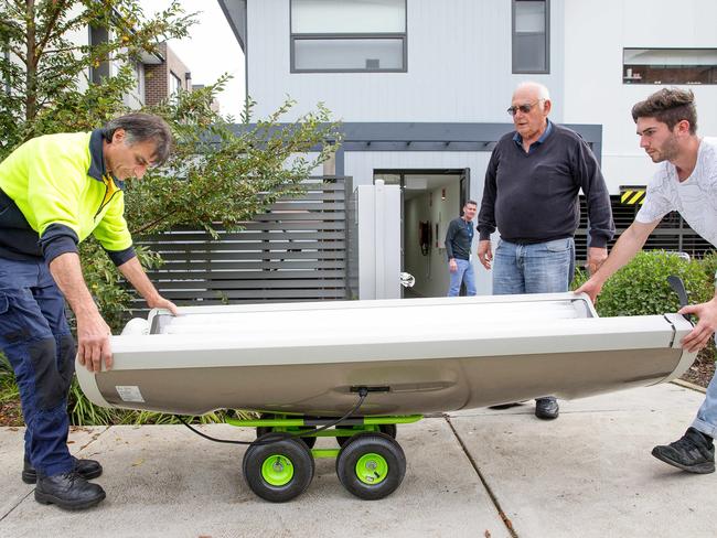 Investigators from the Department of Health raiding a Croydon property suspected of running an illegal solarium. Picture: Mark Stewart
