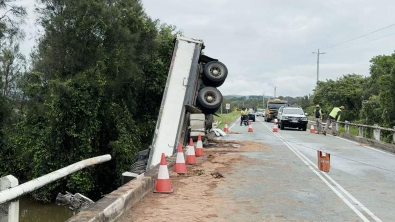 Man’s escape as truck dangles off bridge