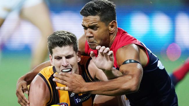 Neville Jetta of the Demons tackle Luke Breust of the Hawks during the AFL Marsh Community Series pre-season match between the Hawthorn Hawks and the Melbourne Demons at UTAS Stadium in Launceston, Friday, March 6, 2020. (AAP Image/Michael Dodge)