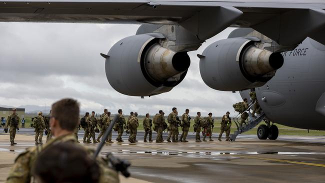 Australian Army soldiers at RAAF Base Townsville, Queensland, to deploy to the Solomon Islands on 26 November 2021.