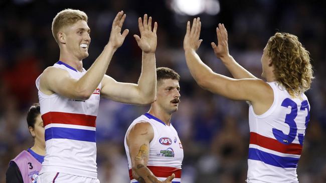 Tim English of the Bulldogs celebrates a goal with Aaron Naughton. Picture: Dylan Burns/AFL Photos via Getty Images