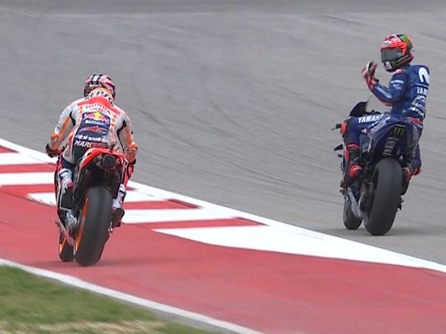 Maverick Vinales gesticulates at Marc Marquez after getting held up during qualifying.