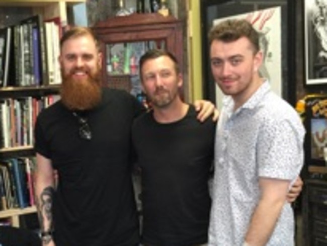 Inking his Australian experience ... Sam Smith gets a tattoo with Sydney tattoo artist Rhys Gordon. Supplied.