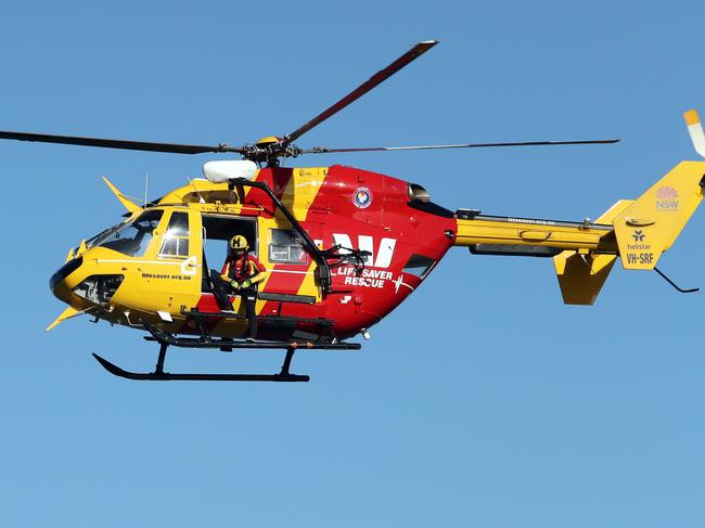 DAILY TELEGRAPH 16TH FEBRUARY 2022Pictured is the Westpac rescue helicopter looking for the body of an individual who may have been attacked by a shark at Little Bay in Sydney.Picture: Richard Dobson