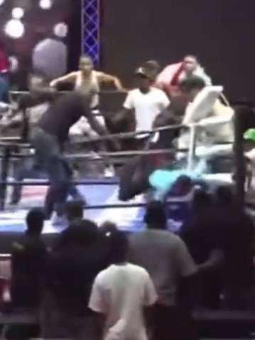 The ref fell out of the ring in a bid to escape. Photo: X
