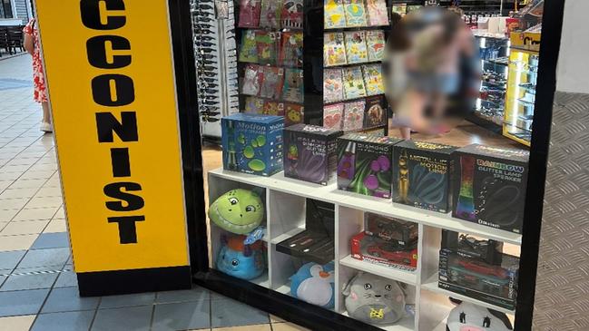 Two unaccompanied children browse inside a Queensland tobacconist. Picture: Kylie Morphett