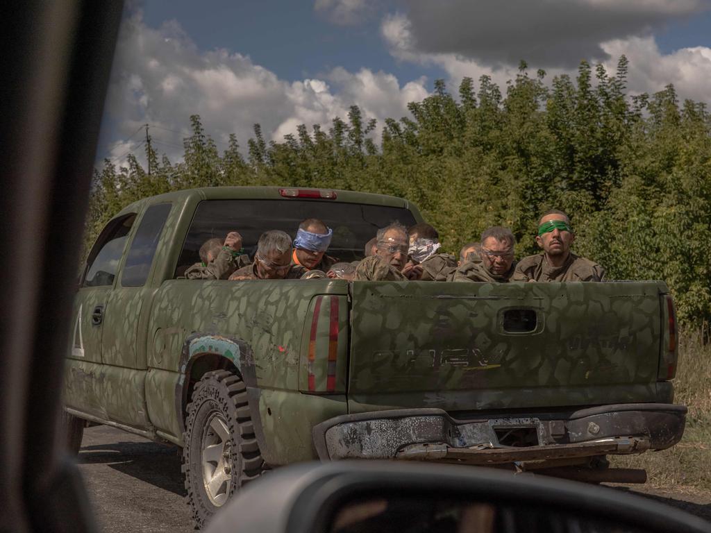 War stories: A Ukrainian military vehicle drives from the direction of the border with Russia carrying blindfolded men in Russian military uniforms, in the Sumy region, on August 13, 2024, amid the Russian invasion of Ukraine. Picture: AFP