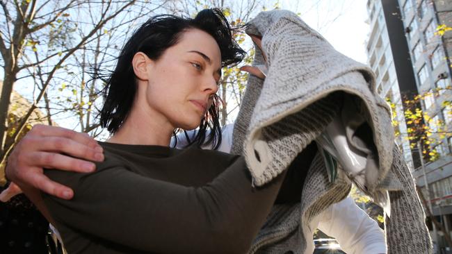 John Ibrahim’s girlfriend, Sarah Budge, leaving Sydney Police Centre in Surry Hills after being bailed on charges of gun possession. Picture: Richard Dobson