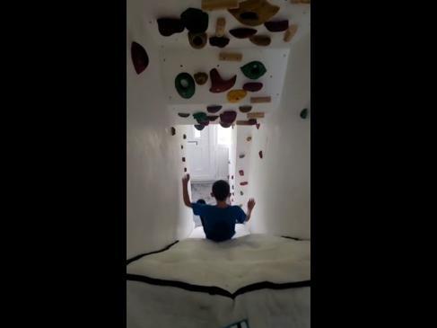 Dad transforms stairs into epic rock climbing course