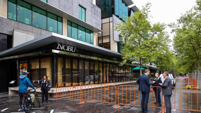 Police and Crown Casino security on scene along Crown Promenade, where a suspected Molotov cocktail was thrown through the window of a restaurant. Picture: Ian Currie