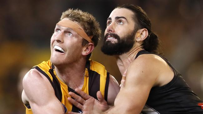 Brodie Grundy contests a thrown in with Hawthorn’s Ben McEvoy. Picture: Dylan Burns/AFL Photos via Getty Images.