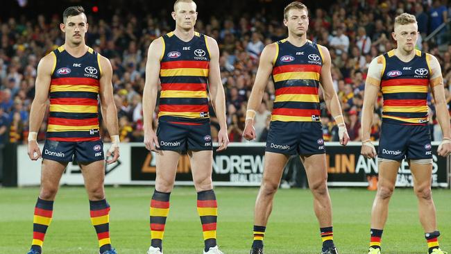 Crows’ Taylor Walker. Sam Jacobs, Daniel Talia and Hugh Greenwood produce the club’s imposing “power stance’’ during the preliminary final against Geelong. Picture: Michael Klein.