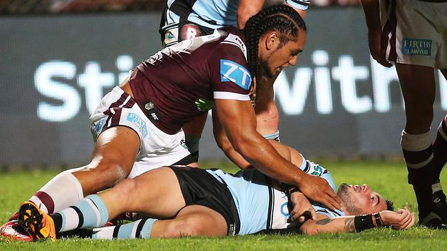 Manly's Martin Taupau looks on at Jack Bird after he knocked him out with late hit during Monday night’s match at Brookvale Oval. Pic: Phil Hillyard