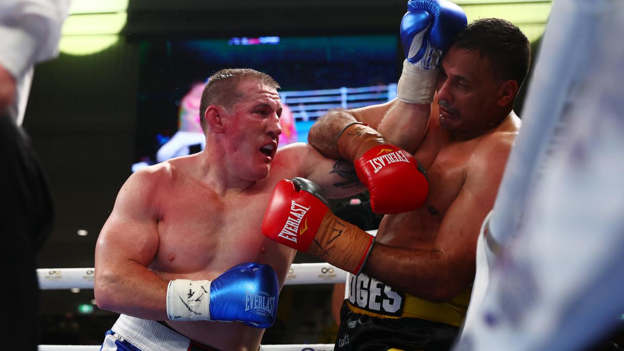 Paul Gallen unleashes on Justin Hodges in their fight in Brisbane. Picture: Chris Hyde/Getty Images