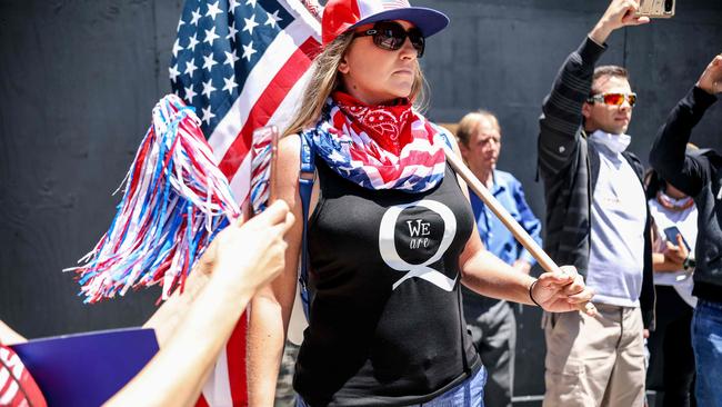 QAnon demonstrators protest during a rally to re-open California from lockdown. Picture: AFP.