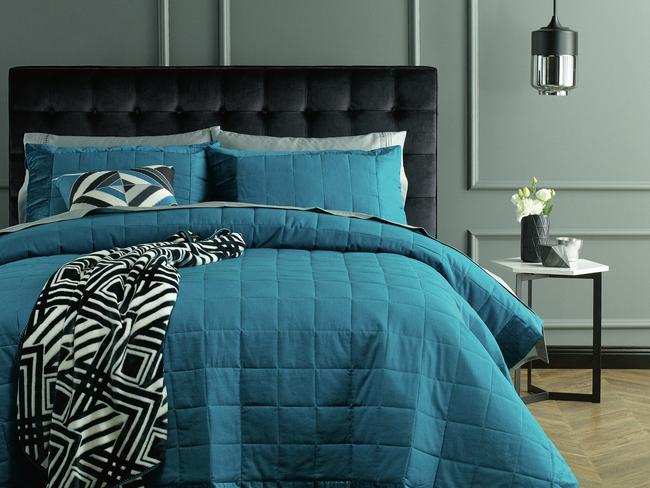 The Kirkton House coverlet set in 'Ocean Depths'.