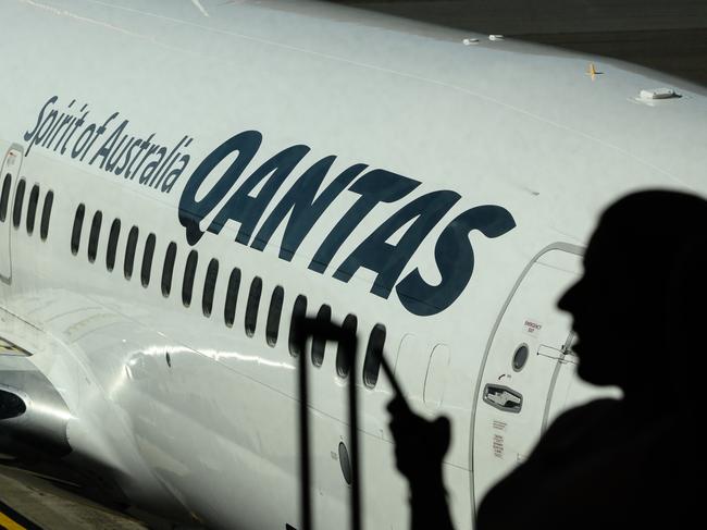 Qantas executives should not be paid bonuses or shareholder dividends until its financial position is stable, new research claims. Picture: AAP