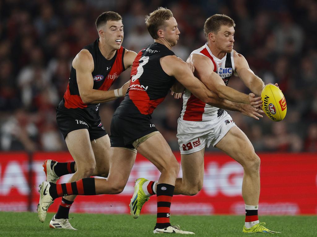 Zach Merrett and Darcy Parish put Seb Ross under pressure. Picture: Michael Klein