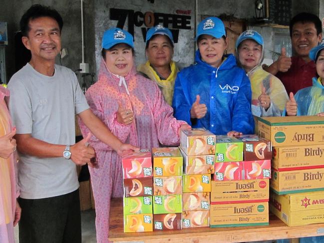 Village volunteers with supplies for the rescue workers. Picture: AAP