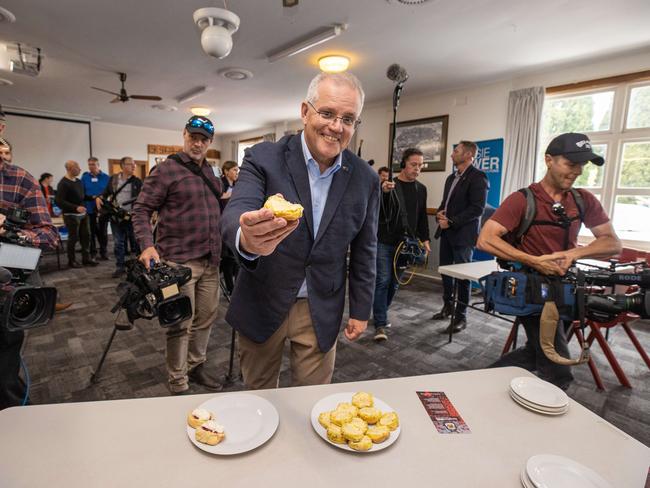 The PM tucks into morning tea at Longford RSL Memorial Club. Picture: Jason Edwards