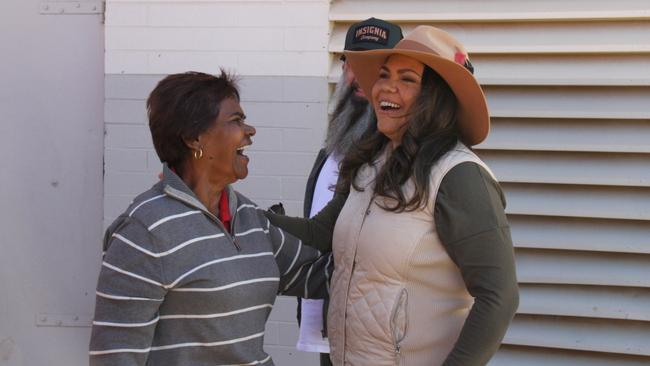 NT Senator Jacinta Price chats to incumbent Labor Lingiari MP Marion Scrymgour ahead of casting her vote alongside her husband Colin Lillie in the 2025 federal election at Braitling Primary School, Alice Springs, May 3, 2025. Picture: Gera Kazakov