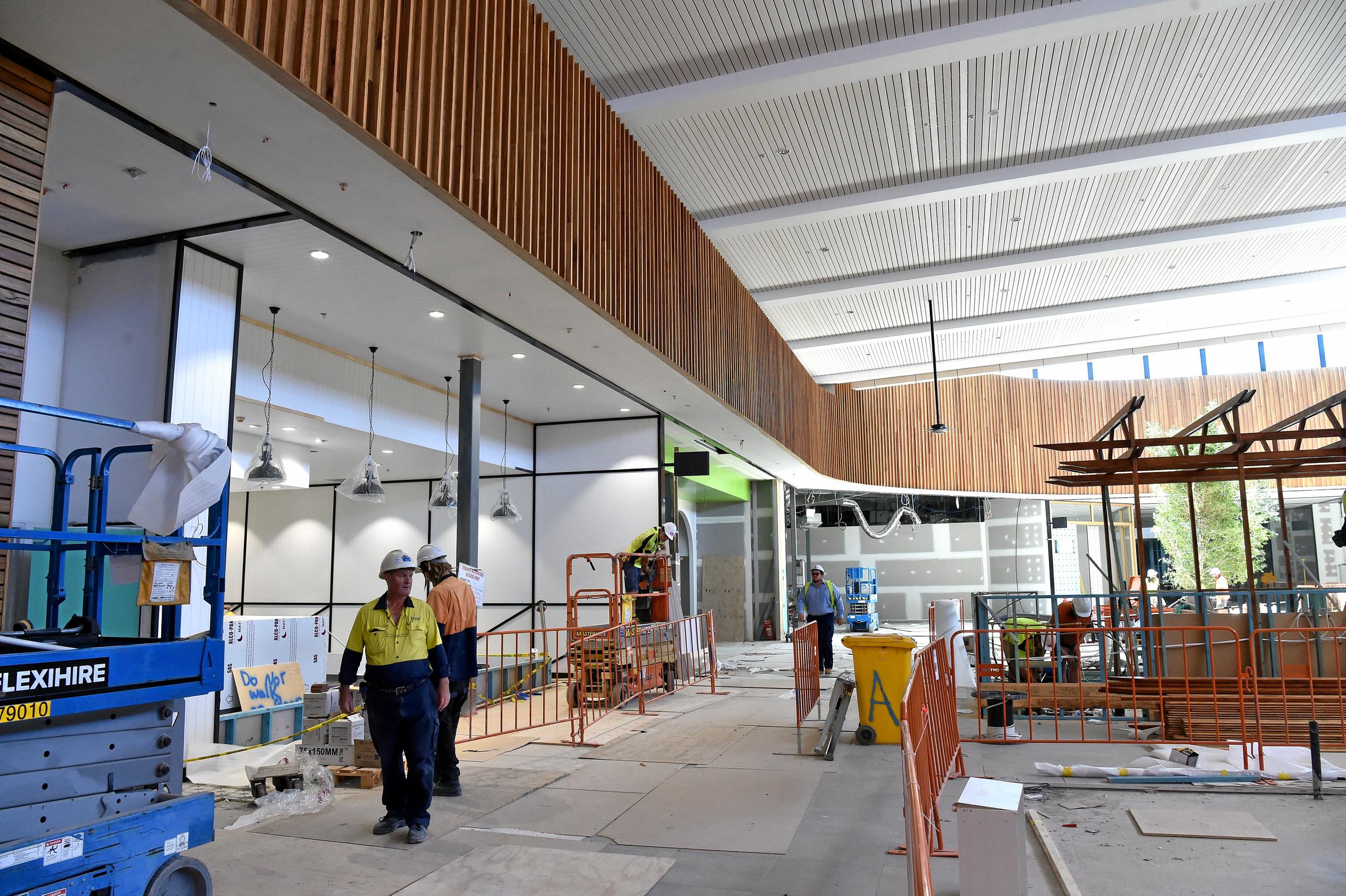 Full steam ahead for the opening of the Stockland Birtinya Shopping Centre. Constuction workers put the final pieces together for the grand opening in a couple of weeks. Picture: Warren Lynam