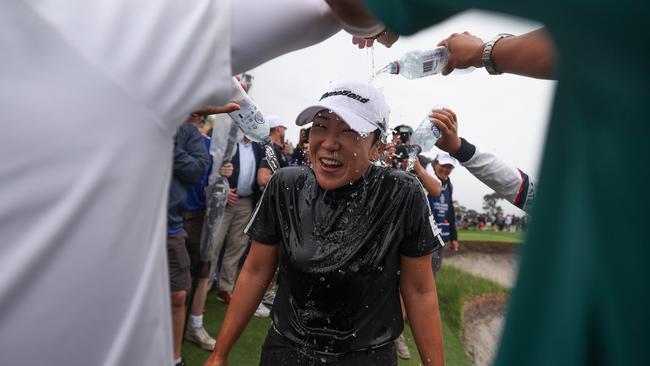 Jiyai Shin celebrates victory on the 18th green on (Photo by Morgan Hancock/Getty Images)