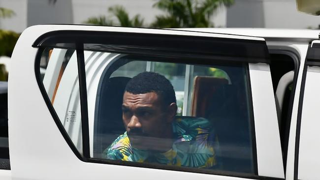 Ilaisa Tanoa, 24, is escorted from a police vehicle to a holding cell at Nadi Magistrate's Court on Monday. ( in the colored shirt )Ilaisa allegedly pretended to be a taxi driver and raped a Virgin Australia crew member faces court for the first time. The man appeared in Nadi Magistrates Court on the island’s west coast on Monday morning, charged with one count of rape and one count of sexual assault for an attack on the 21-year-old flight attendant who was celebrating New Year’s Eve on a layover.