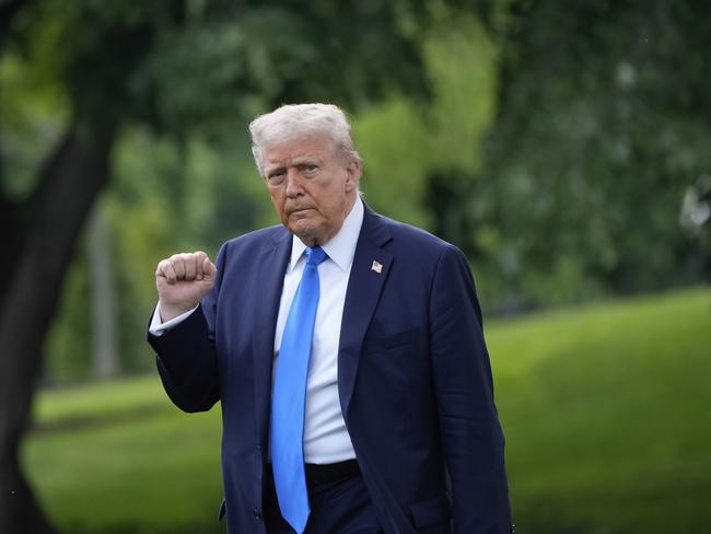 President Donald Trump gestures as he walks from the Oval Office to depart on Marine One from the South Lawn of the White House. Picture: AP