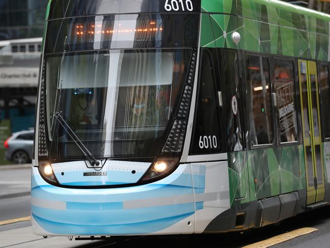 MELBOURNE, AUSTRALIA- NewsWire Photos. OCTOBER 9, 2020: A tram in Collins Street with a blue painted mask during COVID-19 lockdown in Melbourne. Picture: NCA NewsWire/ David Crosling