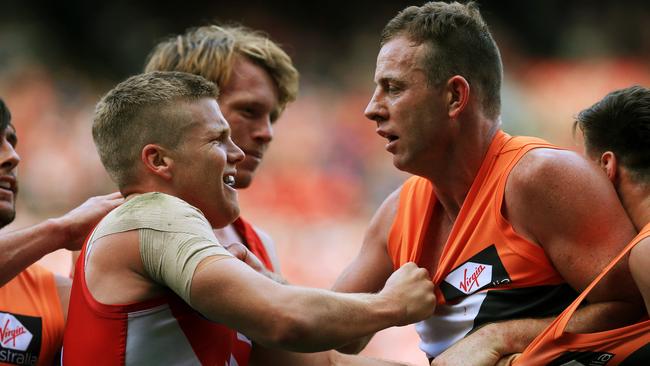 Sydney's Dan Hannebery gets in the face of Steve Johnson. Picture: Toby Zerna