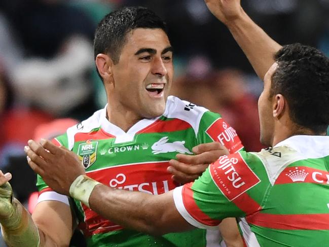 Bryson Goodwin of the Rabbitohs (left) celebrates scoring a try with his team mates during the Round 22 NRL match between the St George Illawarra Dragons and South Sydney Rabbitohs at the SCG in Sydney, Friday, August 4, 2017. (AAP Image/David Moir) NO ARCHIVING, EDITORIAL USE ONLY