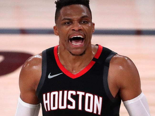 LAKE BUENA VISTA, FLORIDA - SEPTEMBER 12: Russell Westbrook #0 of the Houston Rockets reacts to a fan during the fourth quarter against the Los Angeles Lakers in Game Five of the Western Conference Second Round during the 2020 NBA Playoffs at AdventHealth Arena at the ESPN Wide World Of Sports Complex on September 12, 2020 in Lake Buena Vista, Florida. NOTE TO USER: User expressly acknowledges and agrees that, by downloading and or using this photograph, User is consenting to the terms and conditions of the Getty Images License Agreement.   Michael Reaves/Getty Images/AFP == FOR NEWSPAPERS, INTERNET, TELCOS & TELEVISION USE ONLY ==