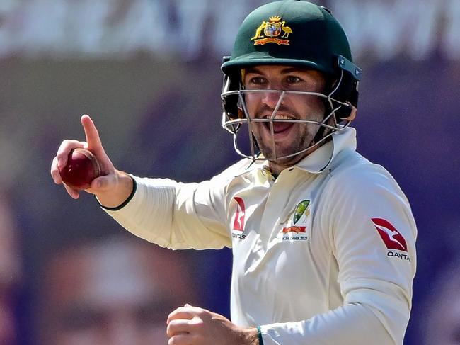 Australia's Josh Inglis takes a catch to dismiss Sri Lanka's Nishan Peiris during the fourth day of the first Test cricket match between Sri Lanka and Australia at the Galle International Cricket Stadium in Galle on February 1, 2025. (Photo by Ishara S. KODIKARA / AFP)