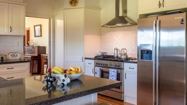 The chef's kitchen has granite benchtops.