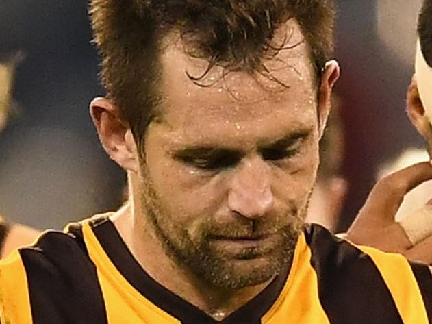 MELBOURNE, AUSTRALIA - APRIL 17:  Luke Hodge of the Hawks  looks dejected as he leads his team off the field after losing the round four AFL match between the Hawthorn Hawks and the Geelong Cats at Melbourne Cricket Ground on April 17, 2017 in Melbourne, Australia.  (Photo by Quinn Rooney/Getty Images)