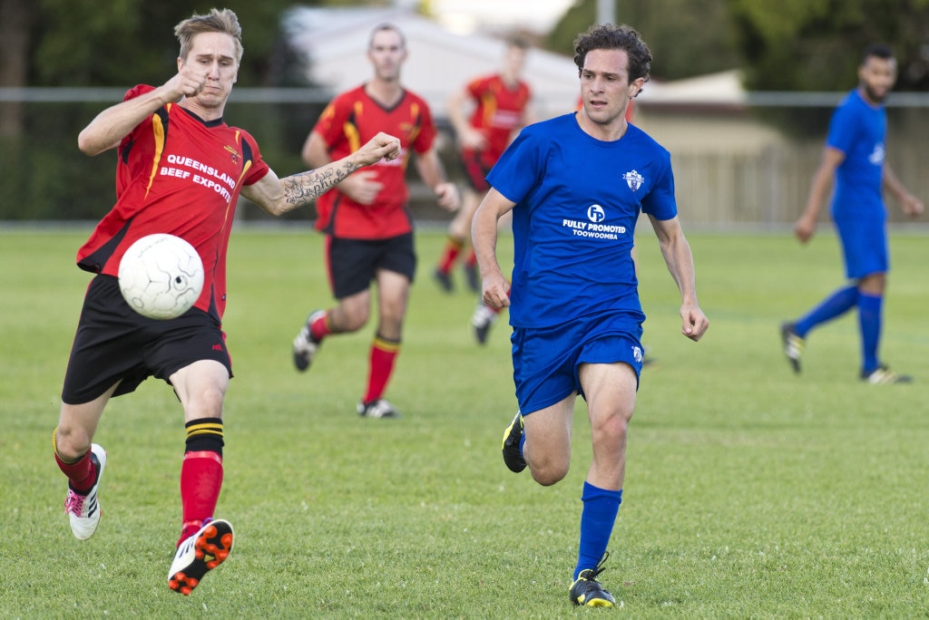 Brendan Newby (left) of Gatton and Braiden Hinch of Rockville race for possession in Toowoomba Football League Premier Men round six at Captain Cook ovals, Sunday, April 7, 2019. Picture: Kevin Farmer