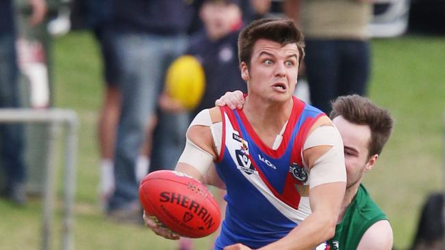 Football GFL: South Barwon v St Mary's South Barwon 18 Jackson Carmody is tackled by St Mary's 31 Trent McMullin Picture: Mark Wilson